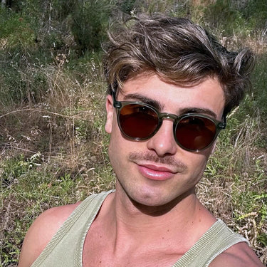 Bologna · round green crystal sunglasses with brown lenses