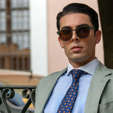 Bologna · round green crystal sunglasses with brown lenses