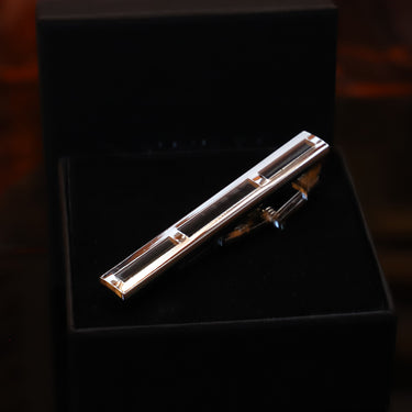 Loro · pasador de corbata color plata y negro - Barlovento de Biar
