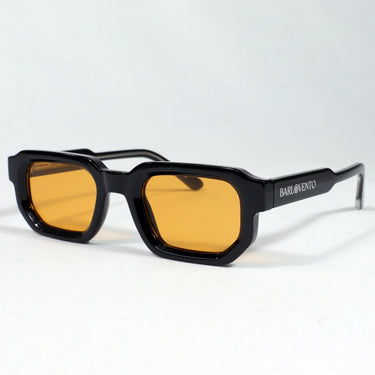 Medano · striking black sunglasses with orange lenses