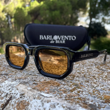 Medano · striking black sunglasses with orange lenses