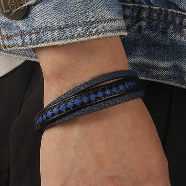 Pulsera Taurus · Pulsera de cuero auténtico trenzado con detalles azules y cierre de aluminio