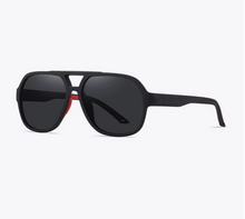 Trengandín · gafas de sol de goma negra con lentes grises y detalles en rojo