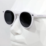 Macarella · gafas de sol redondas blancas con lentes grises - Barlovento de Biar