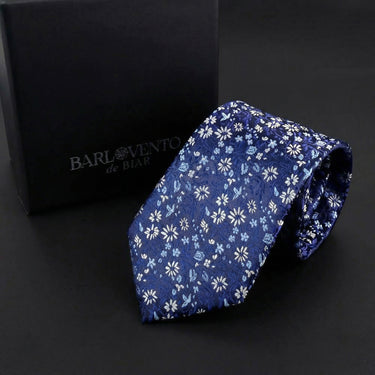 Margaritas · corbata azul brillante con flores blancas