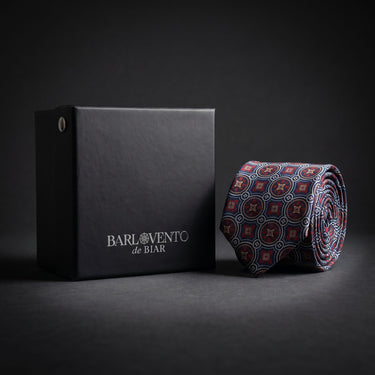 Matera · corbata estilo italiano azul marino con medallones rojos y dorados