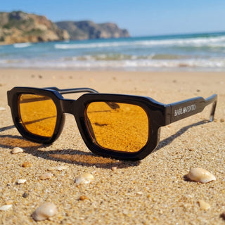 Medano · striking black sunglasses with orange lenses