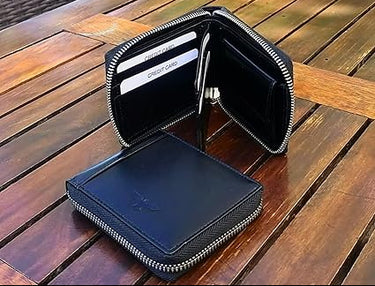 Lugano · Cartera zipper de cuero negro, estilo minimalista