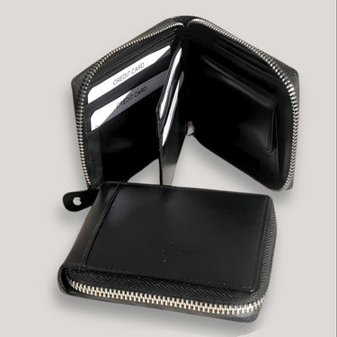 Lugano · Cartera zipper de cuero negro, estilo minimalista