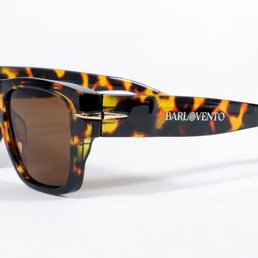 Náufragos · gafas de sol retro premium rojas con forma de llama y lentes marrones