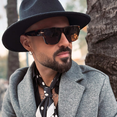 Castaways · Premium retro black sunglasses with brown lenses