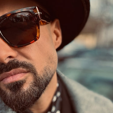 Castaways · Premium retro black sunglasses with brown lenses