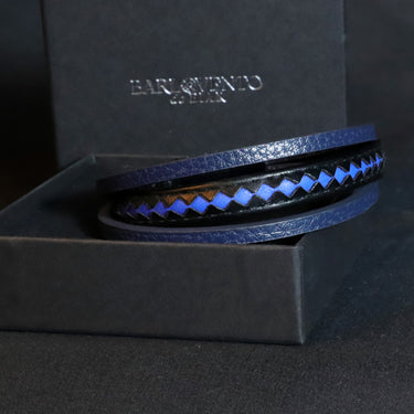 Pulsera Taurus · Pulsera de cuero auténtico trenzado con detalles azules y cierre de aluminio