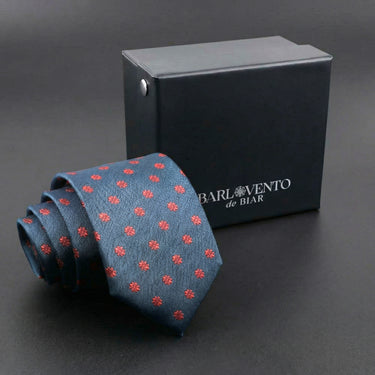 Rosas Rojas · corbata azul con flores rojas geométricas